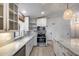 Updated kitchen with granite counters, stainless steel appliances, and white cabinetry at 4443 W Escuda Dr, Glendale, AZ 85308