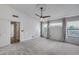 Bright bedroom featuring wainscoting and an ensuite bathroom offering style and functionality at 4443 W Escuda Dr, Glendale, AZ 85308