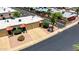 Aerial view showcasing the roof, driveway, and landscaping, in a well-maintained and inviting neighborhood at 4501 E Carol Ave # 77, Mesa, AZ 85206