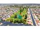 An aerial view of a well-manicured golf course nestled within a residential neighborhood at 4501 E Carol Ave # 77, Mesa, AZ 85206