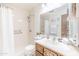 Bright bathroom with a shower, wood vanity, and decorative accents at 4501 E Carol Ave # 77, Mesa, AZ 85206