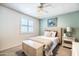 Cozy bedroom featuring soft carpet, a comfortable bed, and ample natural light at 4501 E Carol Ave # 77, Mesa, AZ 85206