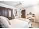Bright bedroom with a ceiling fan, carpet floors, and a vanity area at 4501 E Carol Ave # 77, Mesa, AZ 85206