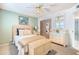 Cozy bedroom featuring soft carpet, a comfortable bed, and ample natural light at 4501 E Carol Ave # 77, Mesa, AZ 85206