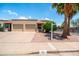 Charming single-Gathering home showcasing well-maintained landscaping, a two-car garage, and a cozy front patio at 4501 E Carol Ave # 77, Mesa, AZ 85206