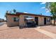 A cozy home featuring a shaded front patio with a swing, offering a relaxing outdoor space at 4501 E Carol Ave # 77, Mesa, AZ 85206