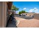 Exterior showing a patio with swing and table, with an attached parking area at 4501 E Carol Ave # 77, Mesa, AZ 85206