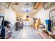 Large garage with washer/dryer, storage shelves, and a work bench at 4501 E Carol Ave # 77, Mesa, AZ 85206