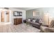 Inviting living room with tiled floors, featuring a comfortable sofa, armchair, and modern decor at 4501 E Carol Ave # 77, Mesa, AZ 85206