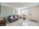 Comfortable living room featuring neutral colors, tiled flooring, and a cozy seating arrangement at 4501 E Carol Ave # 77, Mesa, AZ 85206