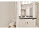 Bathroom features a granite countertop, updated vanity, and a glass-enclosed shower at 5450 E Deer Valley Dr # 1004, Phoenix, AZ 85054