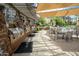 Outdoor grill area featuring built-in grills, seating, and overhead shades, ideal for community gatherings at 5450 E Deer Valley Dr # 1004, Phoenix, AZ 85054