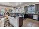 Community kitchen featuring a breakfast bar, stainless steel appliances, and ample counter space, perfect for entertaining at 5450 E Deer Valley Dr # 1004, Phoenix, AZ 85054
