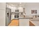 Modern kitchen with stainless steel appliances, granite counters, and seamless flow to living space at 5450 E Deer Valley Dr # 1004, Phoenix, AZ 85054