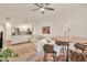 Open concept living space featuring a modern kitchen, comfortable seating area, and a stylish dining table at 5450 E Deer Valley Dr # 1004, Phoenix, AZ 85054