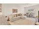 Comfortable living room with stylish furniture, ample natural light, and open to kitchen at 5450 E Deer Valley Dr # 1004, Phoenix, AZ 85054