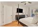 Bright bedroom featuring a four-poster bed, dark wood dresser, and minimalist decor at 5450 E Deer Valley Dr # 1004, Phoenix, AZ 85054