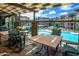 Inviting outdoor patio area overlooking a sparkling community pool and manicured landscaping at 5450 E Deer Valley Dr # 1004, Phoenix, AZ 85054