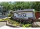 Elegant community entrance sign surrounded by colorful flowers and lush greenery at 5450 E Deer Valley Dr # 1004, Phoenix, AZ 85054