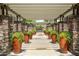 Beautiful community walkway framed by stone pillars and potted plants, creating a welcoming atmosphere at 5450 E Deer Valley Dr # 1004, Phoenix, AZ 85054