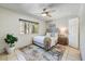Bedroom featuring neutral walls and tile flooring, as well as a ceiling fan at 5710 E Anderson Dr, Scottsdale, AZ 85254