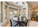 Cozy breakfast nook with a round table, seating for four, and windows overlooking the pool area at 5710 E Anderson Dr, Scottsdale, AZ 85254