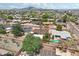 Property showcasing a refreshing pool and vibrant landscaping, with stunning mountain views in the distance at 7049 E Latham St, Scottsdale, AZ 85257