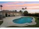 A refreshing pool surrounded by lush landscaping and a spacious patio, perfect for outdoor gatherings at 7049 E Latham St, Scottsdale, AZ 85257