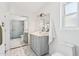 Modern bathroom featuring geometric floor tiles, marble countertop, and glass shower at 7049 E Latham St, Scottsdale, AZ 85257