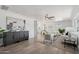 Open-concept living area showcasing modern furniture, neutral tones, and seamless flow into the kitchen and dining spaces at 7049 E Latham St, Scottsdale, AZ 85257