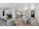 Open-concept living area with new flooring, stainless steel appliances, and modern decor at 7049 E Latham St, Scottsdale, AZ 85257