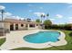 Backyard pool featuring an adjacent backyard home and palm trees at 7049 E Latham St, Scottsdale, AZ 85257