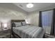 Neutral bedroom design featuring a Queen bed, wood nightstands, and gray walls at 7140 E Juanita Ave, Mesa, AZ 85209