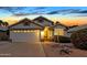 Charming single-Gathering home with a two-car garage, manicured landscaping, and a welcoming entrance at 7140 E Juanita Ave, Mesa, AZ 85209