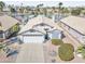 Charming single-Gathering home boasts a three-car garage and manicured front yard at 7140 E Juanita Ave, Mesa, AZ 85209