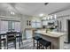 Well-equipped kitchen with granite counters, stainless appliances, and adjacent breakfast nook at 7140 E Juanita Ave, Mesa, AZ 85209