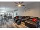 Open-concept living area featuring sleek flooring, modern furnishings, and a breakfast bar at 7140 E Juanita Ave, Mesa, AZ 85209