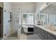 Bright bathroom with a glass shower, soaking tub, vanity with double sinks and tiled walls at 7925 E Osage Ave, Mesa, AZ 85212