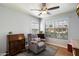 Bright bedroom features a ceiling fan and a large window with view of trees outside at 7925 E Osage Ave, Mesa, AZ 85212