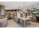 Well-appointed kitchen with stainless steel appliances, kitchen island, and modern pendant lighting at 7925 E Osage Ave, Mesa, AZ 85212