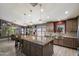 Modern kitchen featuring stainless steel appliances, and an eat-in kitchen island at 7925 E Osage Ave, Mesa, AZ 85212