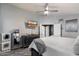 Contemporary main bedroom features a mounted television and neutral decor at 7925 E Osage Ave, Mesa, AZ 85212