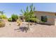 Backyard featuring desert landscaping and covered patio at 794 W Leatherwood Ave, Queen Creek, AZ 85140
