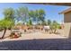 Backyard featuring desert landscaping, brick pavers, and built in grill at 794 W Leatherwood Ave, Queen Creek, AZ 85140