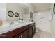 Bathroom featuring double sinks, granite counters, and a shower/tub combo at 794 W Leatherwood Ave, Queen Creek, AZ 85140