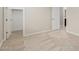 Bright bedroom features neutral carpet, baseboards, trim, and closet at 794 W Leatherwood Ave, Queen Creek, AZ 85140