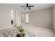 Bright bedroom featuring a modern ceiling fan and neutral color palette at 794 W Leatherwood Ave, Queen Creek, AZ 85140