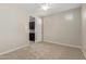 Clean, light-filled bedroom with modern features, neutral carpet, and good lighting at 794 W Leatherwood Ave, Queen Creek, AZ 85140