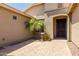 Home entryway featuring a brick-paved porch, a security door, and desert landscaping at 794 W Leatherwood Ave, Queen Creek, AZ 85140