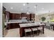 Kitchen featuring a spacious island with seating, stainless steel appliances, and modern lighting at 794 W Leatherwood Ave, Queen Creek, AZ 85140
